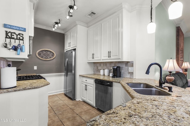 kitchen featuring visible vents, a sink, appliances with stainless steel finishes, white cabinetry, and crown molding