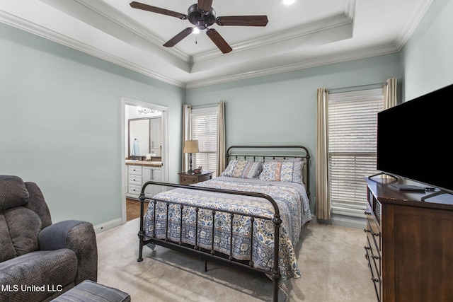 bedroom with a raised ceiling, crown molding, and light colored carpet