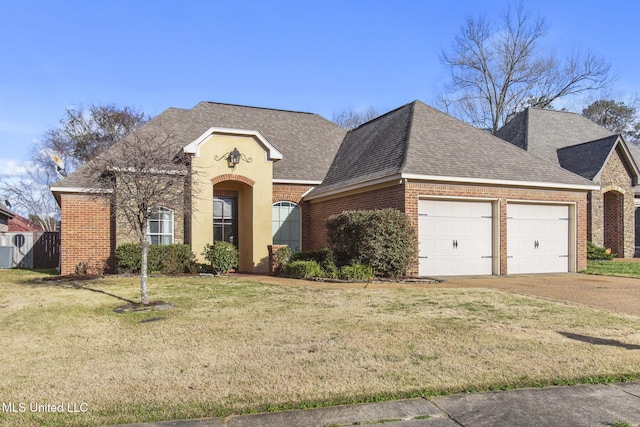 french provincial home with driveway, a front yard, a shingled roof, a garage, and brick siding