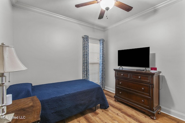 bedroom with ceiling fan, light wood-style floors, baseboards, and ornamental molding