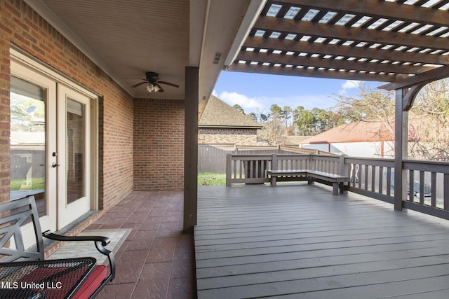 deck featuring a ceiling fan, fence, and a pergola