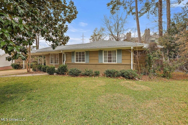 ranch-style home featuring a front yard