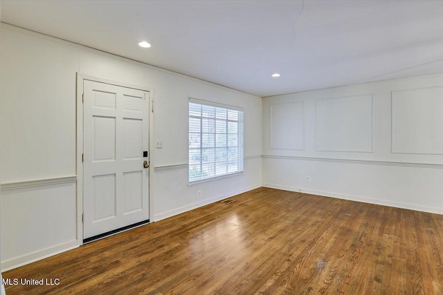 foyer entrance featuring hardwood / wood-style floors