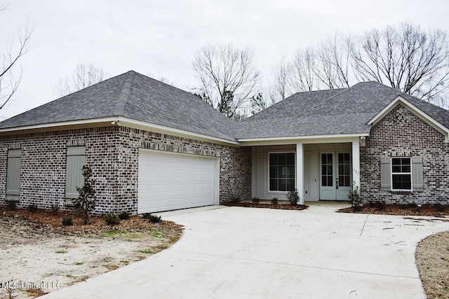 view of front facade with a porch and a garage