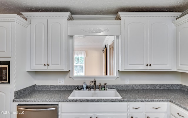 315 Church St, Madison, MS 39110 - kitchen featuring a sink, dishwasher, dark countertops, white cabinetry, and a textured ceiling