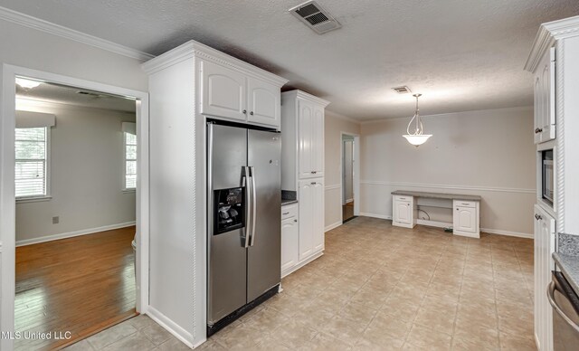 315 Church St, Madison, MS 39110 - kitchen featuring stainless steel appliances, white cabinetry, ornamental molding, hanging light fixtures, and baseboards