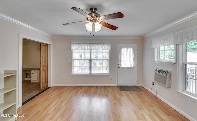 315 Church St, Madison, MS 39110 - entryway featuring a wall mounted air conditioner, wood finished floors, crown molding, ceiling fan, and baseboards