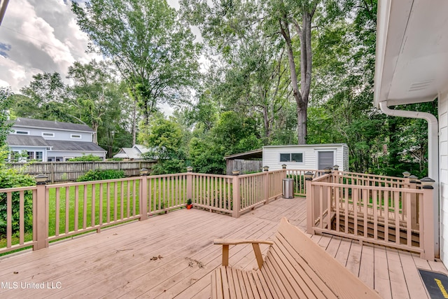 315 Church St, Madison, MS 39110 - wooden deck with view of wooded area and an outdoor structure