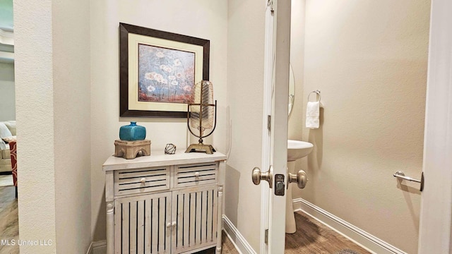 15109 Windmill Ridge Parkway, Diberville, MS 39540 - hallway featuring wood finished floors and baseboards