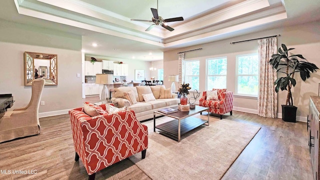 15109 Windmill Ridge Parkway, Diberville, MS 39540 - living area with a raised ceiling, ornamental molding, a ceiling fan, wood finished floors, and recessed lighting