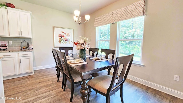 15109 Windmill Ridge Parkway, Diberville, MS 39540 - dining room featuring plenty of natural light, a chandelier, and light wood-style flooring