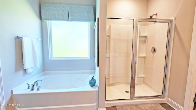 15109 Windmill Ridge Parkway, Diberville, MS 39540 - bathroom with a shower stall and a garden tub