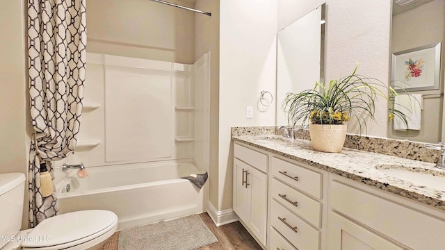 15109 Windmill Ridge Parkway, Diberville, MS 39540 - bathroom featuring double vanity,  shower combination, and wood finished floors
