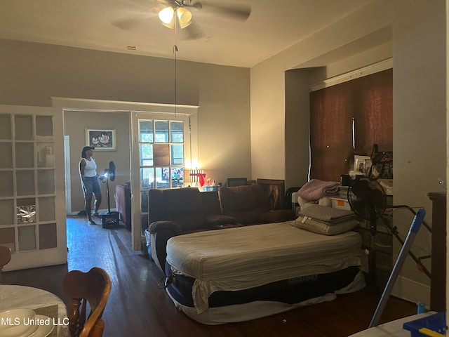 bedroom with wood-type flooring and ceiling fan