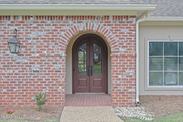 207 Keystone Pl, Brandon, MS 39042 - entrance to property with brick siding, a shingled roof, and french doors