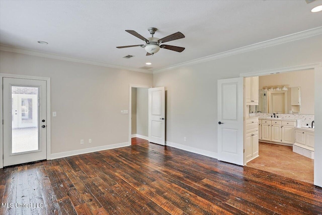 207 Keystone Pl, Brandon, MS 39042 - unfurnished bedroom with crown molding, wood-type flooring, a sink, baseboards, and ensuite bath