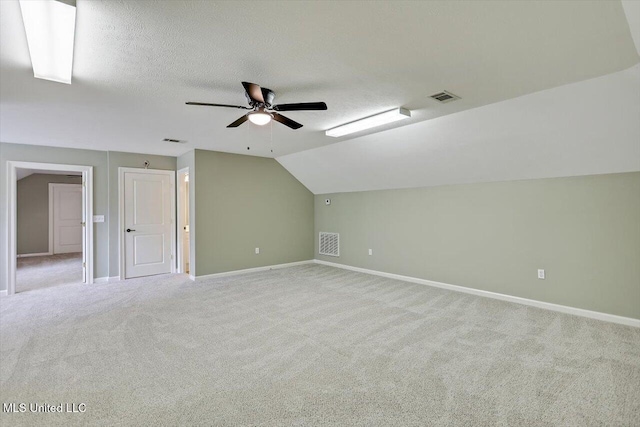 207 Keystone Pl, Brandon, MS 39042 - additional living space featuring ceiling fan, baseboards, lofted ceiling, carpet flooring, and a textured ceiling