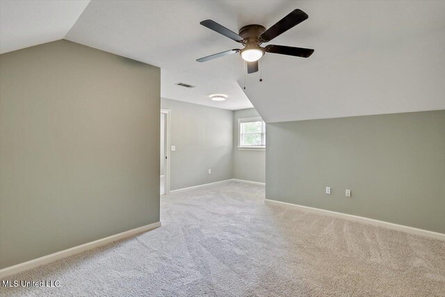 207 Keystone Pl, Brandon, MS 39042 - bonus room featuring vaulted ceiling, a ceiling fan, light colored carpet, and baseboards