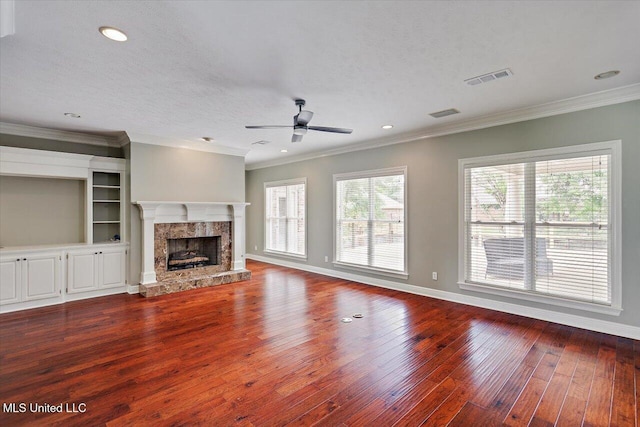 207 Keystone Pl, Brandon, MS 39042 - unfurnished living room with wood-type flooring, ceiling fan, crown molding, a high end fireplace, and baseboards