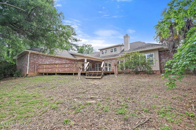 207 Keystone Pl, Brandon, MS 39042 - back of property featuring brick siding, a deck, and a chimney