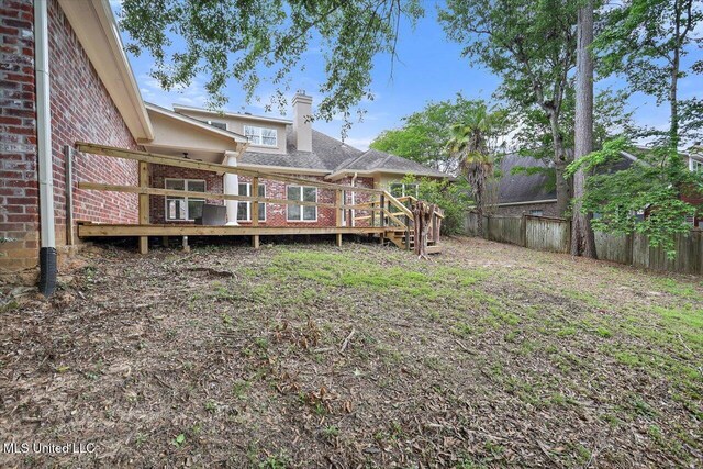 207 Keystone Pl, Brandon, MS 39042 - view of yard featuring fence and a wooden deck