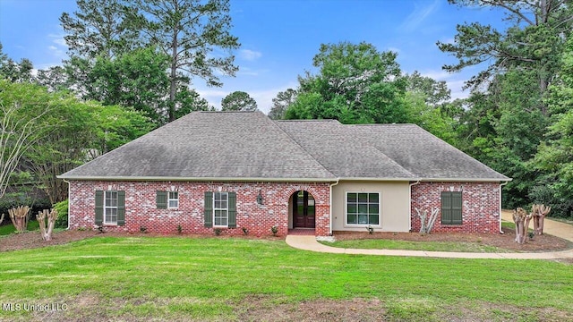 207 Keystone Pl, Brandon, MS 39042 - view of front of house featuring a front lawn, a shingled roof, and brick siding
