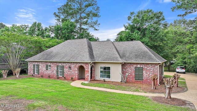 207 Keystone Pl, Brandon, MS 39042 - view of front facade featuring a front lawn, a shingled roof, and brick siding