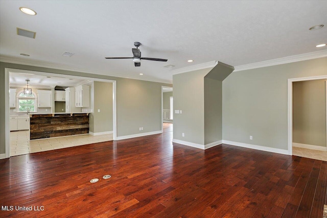 207 Keystone Pl, Brandon, MS 39042 - unfurnished living room featuring light wood-style flooring, crown molding, ceiling fan, recessed lighting, and baseboards