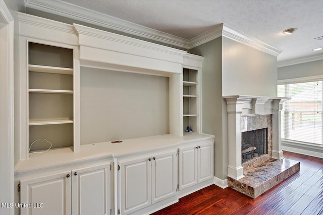 207 Keystone Pl, Brandon, MS 39042 - unfurnished living room featuring dark wood-style flooring, a high end fireplace, crown molding, baseboards, and recessed lighting