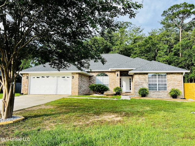 ranch-style home featuring a garage, fence, driveway, roof with shingles, and a front lawn