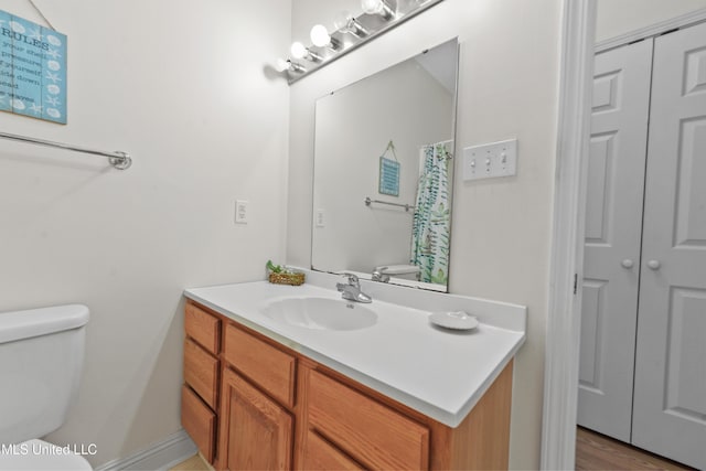 full bath with vanity and toilet