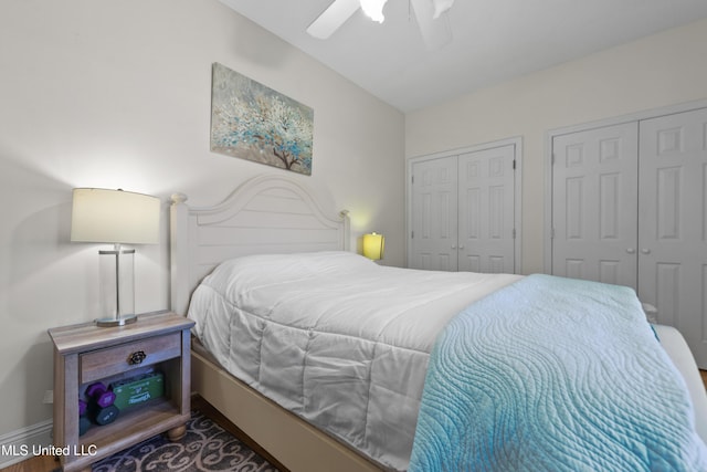 bedroom with multiple closets and a ceiling fan