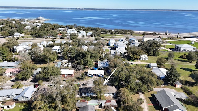 drone / aerial view with a water view and a residential view