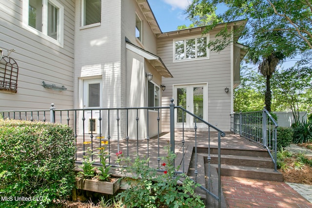 doorway to property featuring a wooden deck