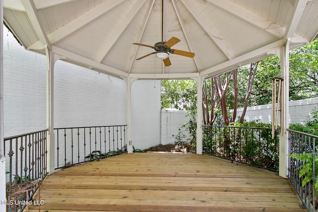 wooden terrace featuring ceiling fan