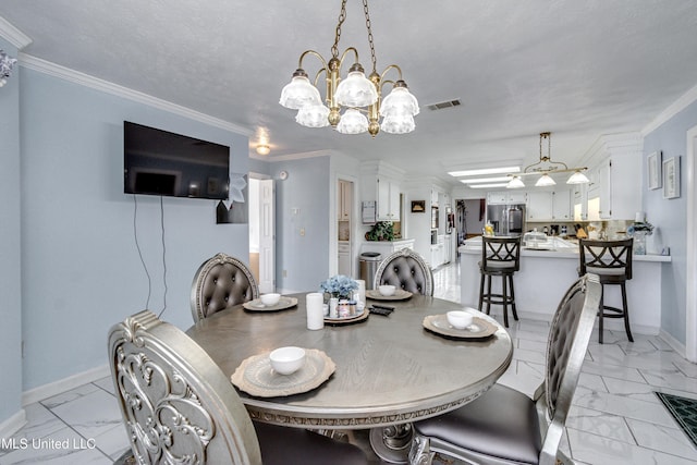 dining space with crown molding, a chandelier, and a textured ceiling