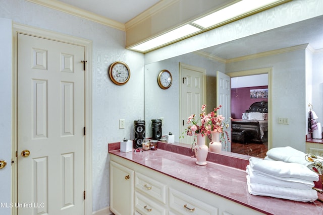 bathroom with crown molding and vanity