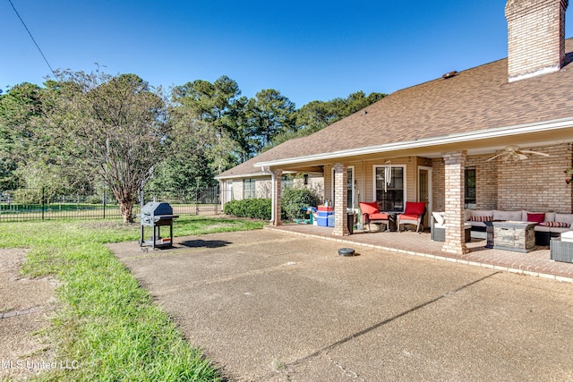 view of patio / terrace with an outdoor living space, area for grilling, and ceiling fan