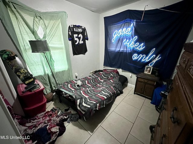 bedroom with light tile patterned floors