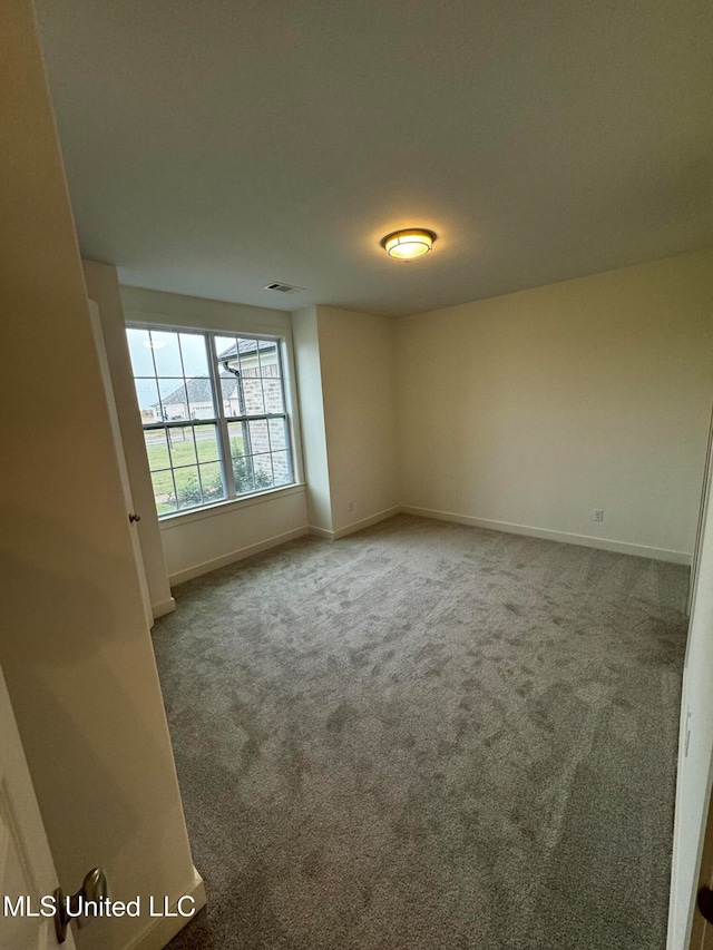 spare room with carpet flooring