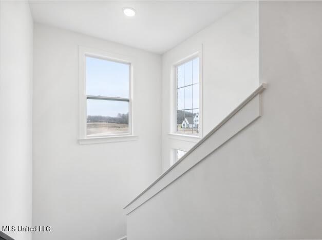 staircase featuring a healthy amount of sunlight