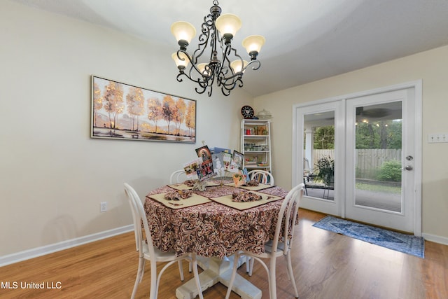 dining room featuring a chandelier and hardwood / wood-style flooring