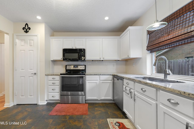 kitchen featuring white cabinets, sink, and appliances with stainless steel finishes