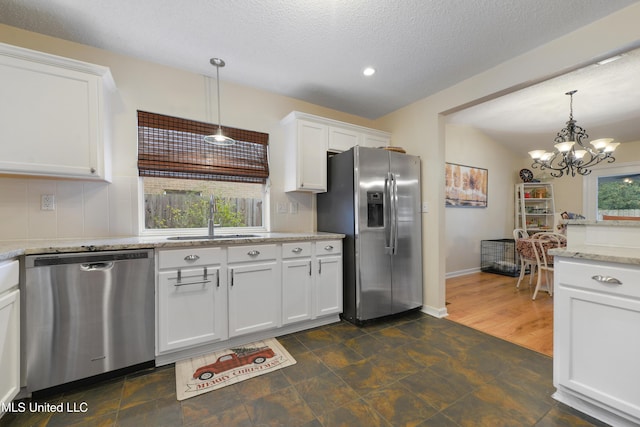 kitchen with white cabinets, a healthy amount of sunlight, sink, and appliances with stainless steel finishes