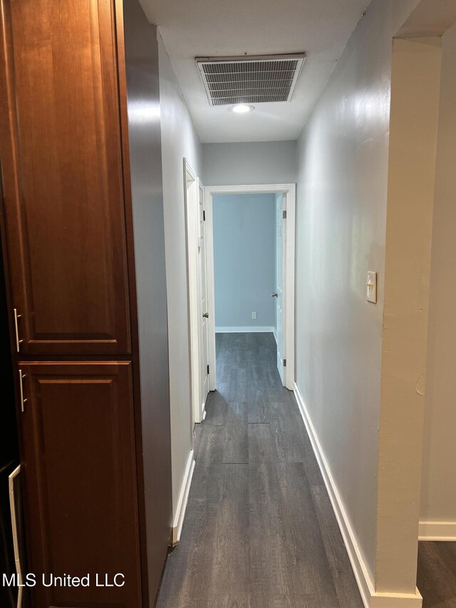 3715 Parkview St, Vicksburg, MS 39180 - hall with dark wood-style floors, visible vents, and baseboards