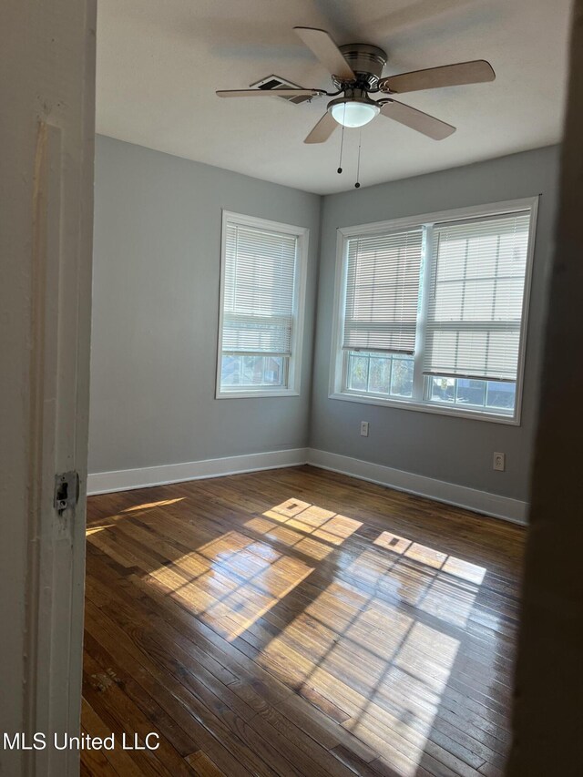 3715 Parkview St, Vicksburg, MS 39180 - empty room featuring wood-type flooring, a ceiling fan, and baseboards