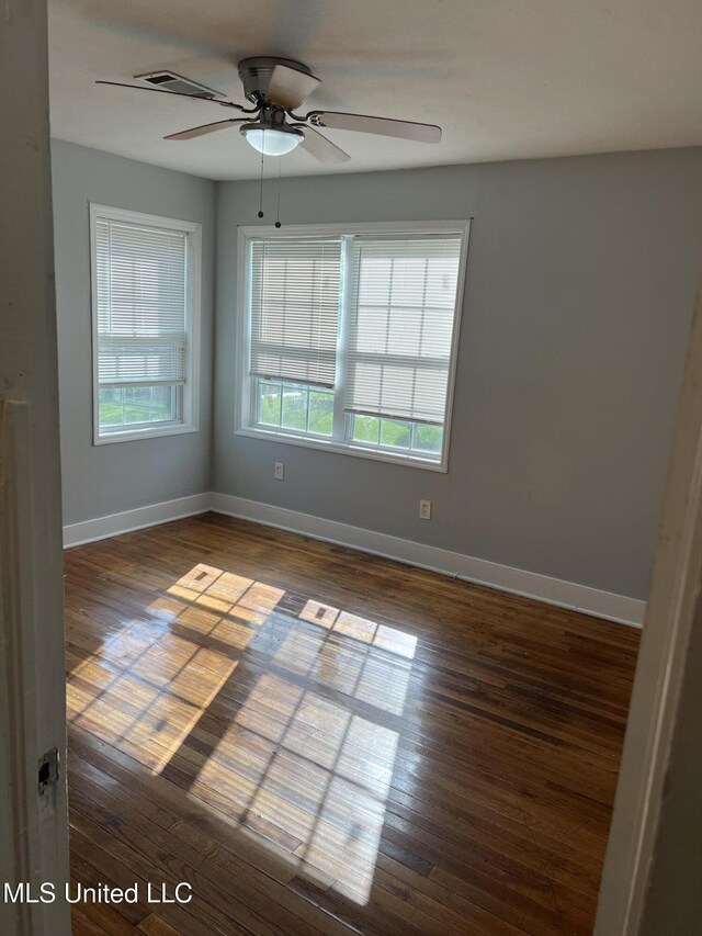 3715 Parkview St, Vicksburg, MS 39180 - spare room featuring baseboards, wood finished floors, and a ceiling fan