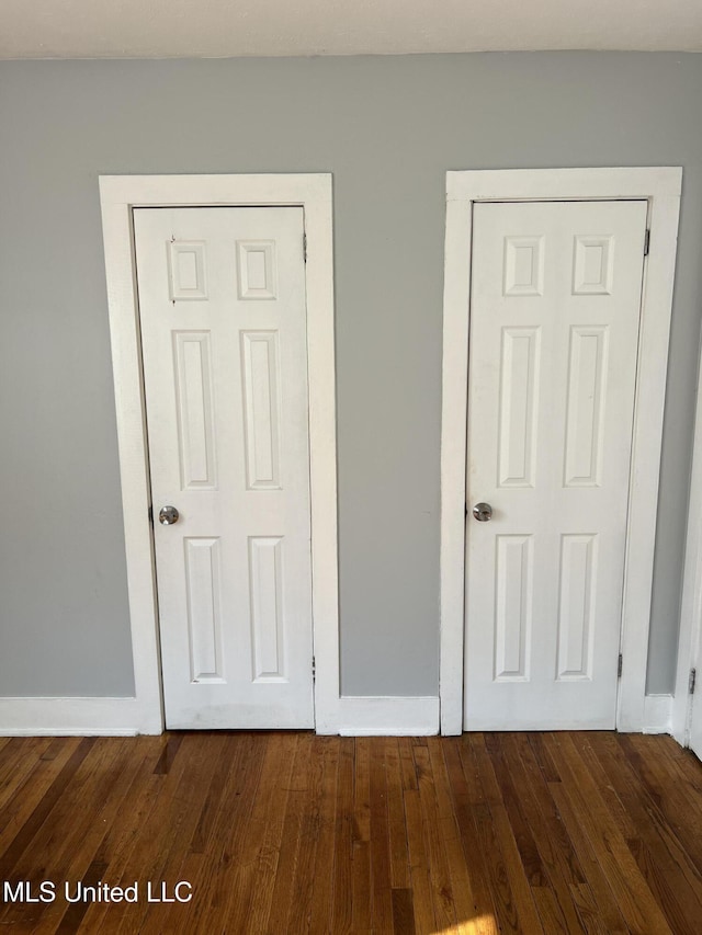 3715 Parkview St, Vicksburg, MS 39180 - unfurnished bedroom with dark wood-style floors and baseboards