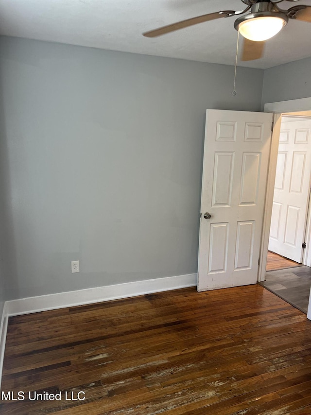 3715 Parkview St, Vicksburg, MS 39180 - unfurnished room featuring dark wood-type flooring, baseboards, and ceiling fan