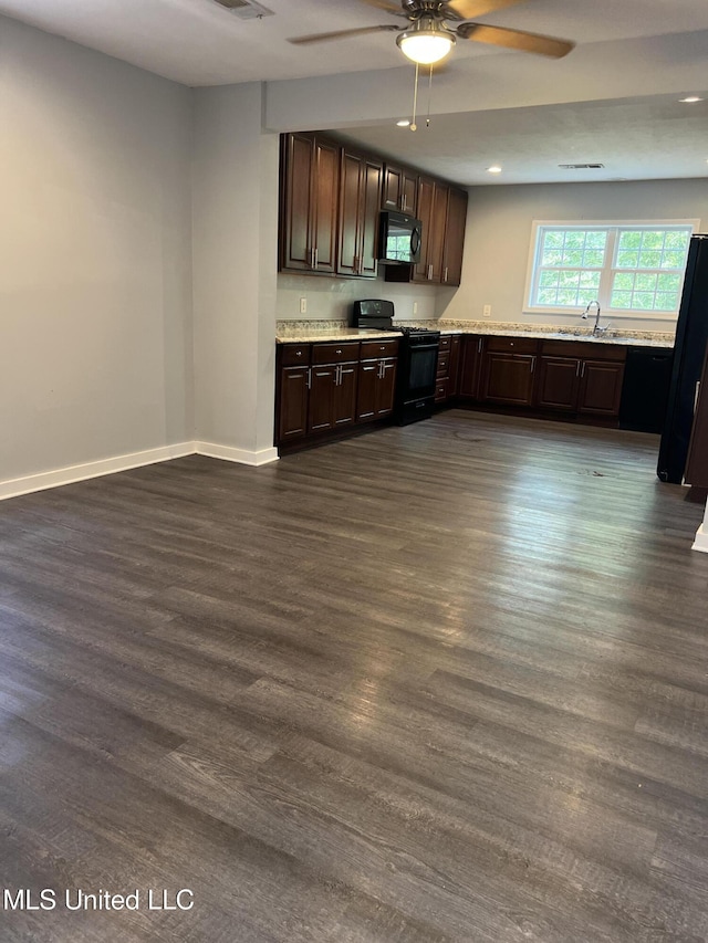 3715 Parkview St, Vicksburg, MS 39180 - kitchen with light countertops, a sink, a ceiling fan, dark brown cabinetry, and black appliances